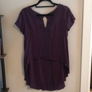 Purple top, cropped in front, long in back